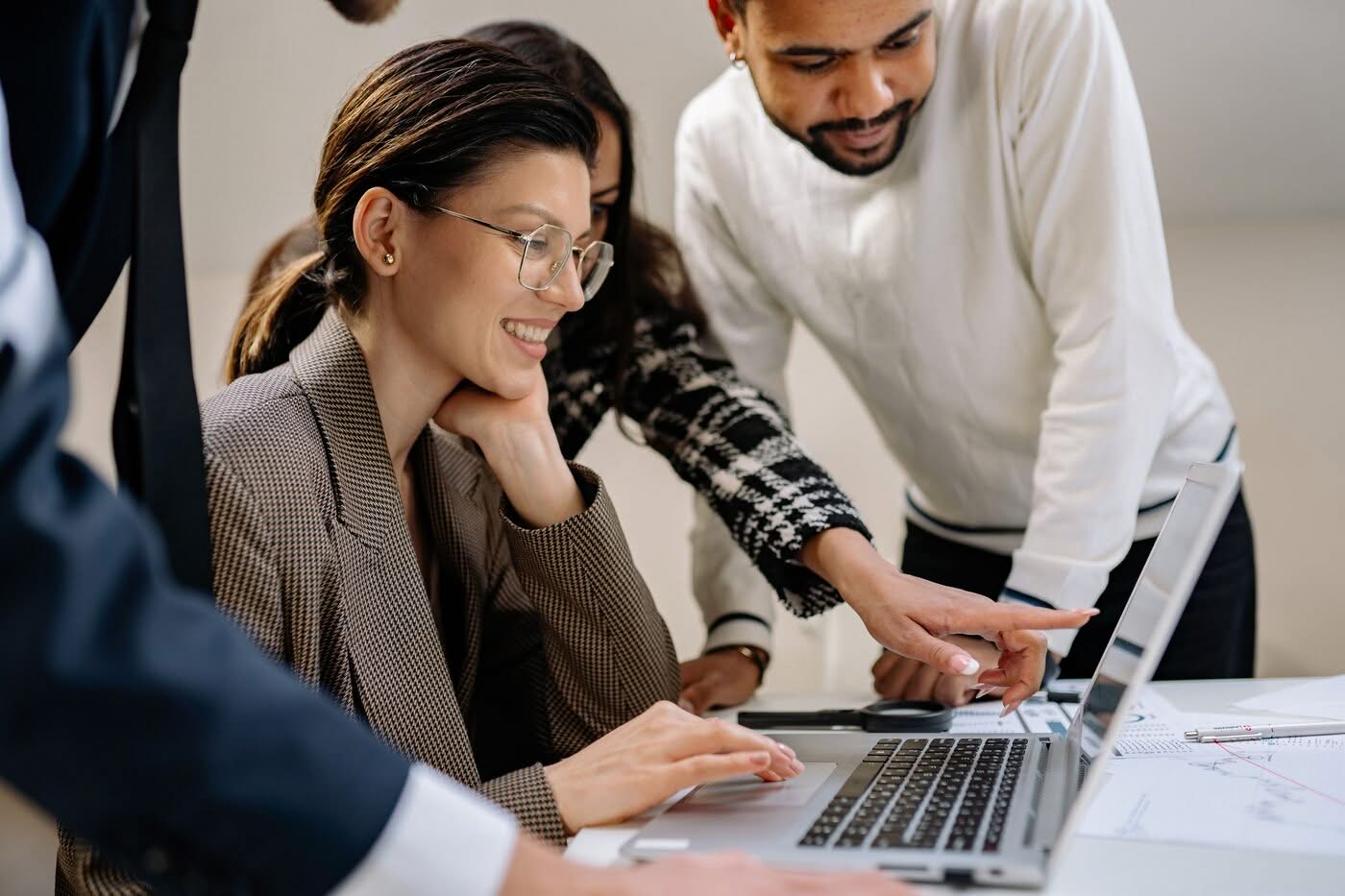 Business owner reviewing technology systems and digital reports to identify business technology questions and support future growth.